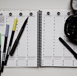 open planner with pens