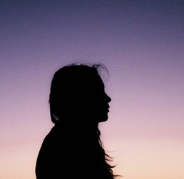 girl with sunset in background