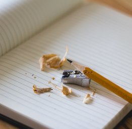 notebook with sharpened pencil