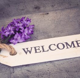 welcome sign with flowers